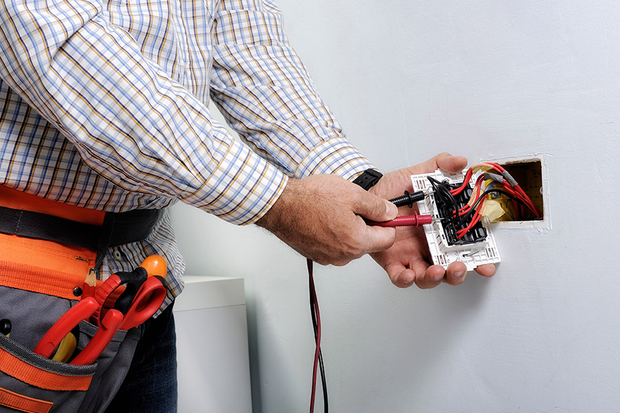 electrician-repairing-residential-property-wall-outlet-acworth-ga